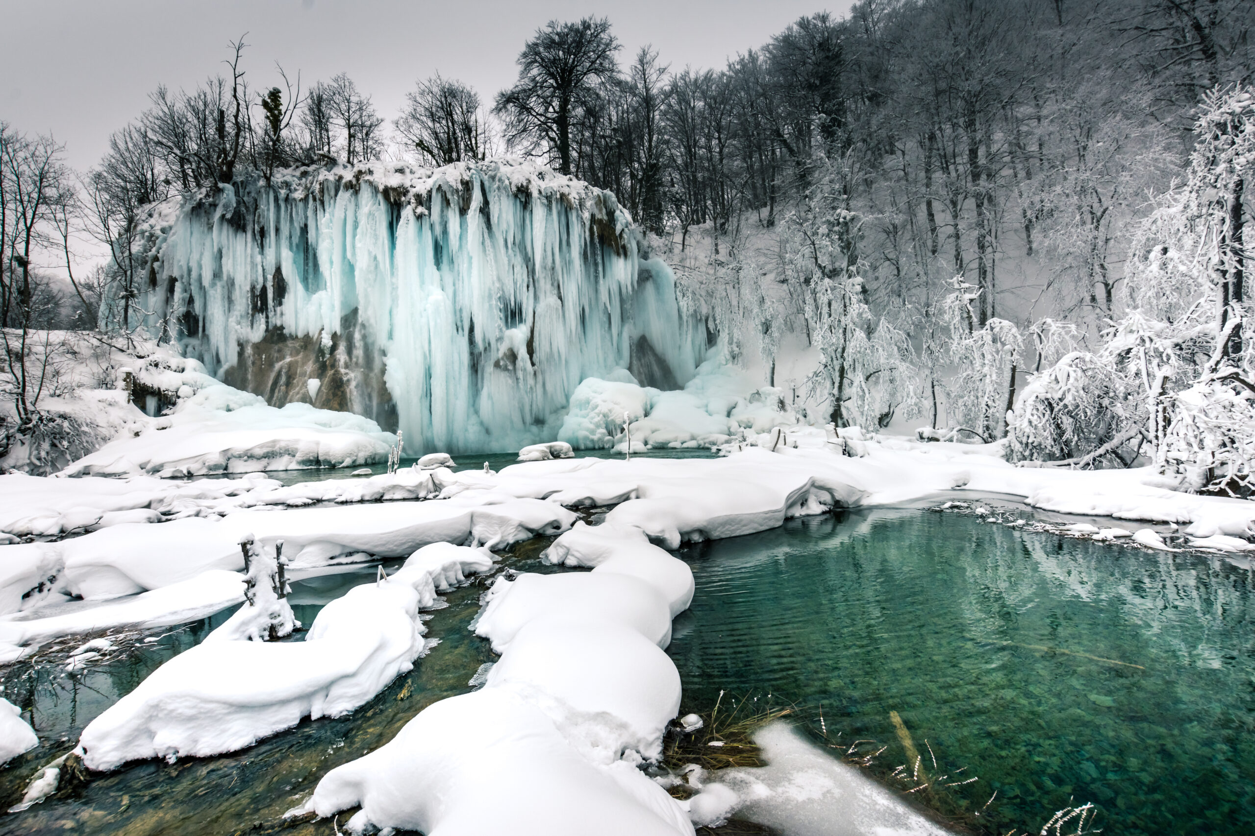 Frozen waterfalls and snow in national Park in Croatia.